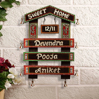 'Home Of The Heart' Customisable Hut Shaped Warli & Dhokra Wooden Name Plate With Handwritten Fonts