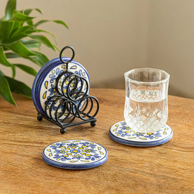 ExclusiveLane 'Bloomy' Ceramic Tea Coasters with Iron Holder (Set Of 4, Hand-Painted)
