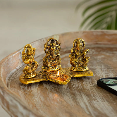 'Laxmi Ganesh & Saraswati' Idol Showpiece Figurine with Diya (1 Wick, 9.4 cm, Golden, Metal, Handcrafted)