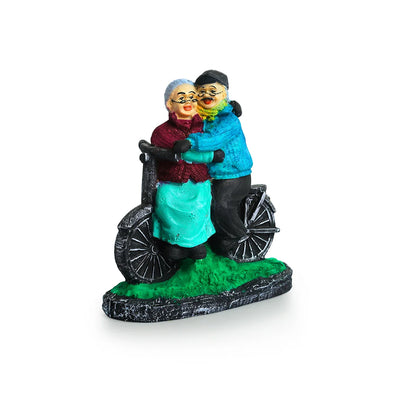 'Italian Old Cycling Couple' Modern Decorative Showpiece Statue (Resin, Handcrafted, 19.1 cm)