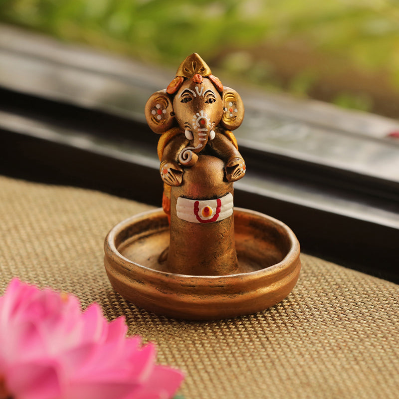 Terracotta Handpainted Copper Finish Baby Ganesha Holding Lord Shiva In Pound