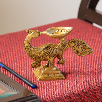 'Gleaming Peacock' Hand-Etched Carved Diya In Brass (730 Grams)